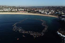 Surfers form massive heart in tribute to Bondi Beach victims