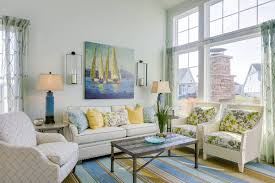 A modern, fresh space that really the way that the blue color is integrated is perfectly done, with blue furniture pieces mixed in with grey, beige and white. Living Room Color Trends For Summer 2021 From The Bright To The Pastel