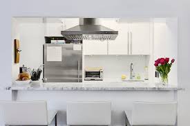The half wall also creates the perfect corner to accommodate extra appliances like the oven. Why A Galley Kitchen Rules In Small Kitchen Design