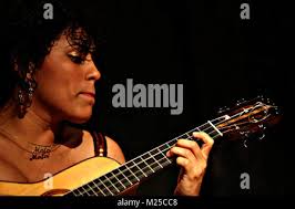 In this Feb. 6, 2015 photo, Maria Witkowski hands a Hunt Brothers Pizza  from the drive-thru window to a customer at the Rightway Foodmart in  Andersonville, Tenn. Hunt Brothers Pizza is quietly