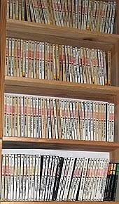 This file photo taken in brussels on february 24, 2012 shows belgian scriptwriter henri vernes, creator of the comic strip bob morane, posing with his book memoires during an interview. Yjbbslvb2e0fnm