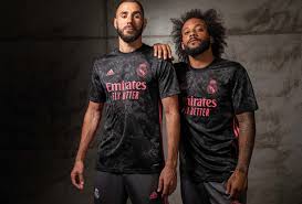 The three adidas stripes across the home shirt's shoulders on the current kit are set to be removed, in favour of pink stripes that run down the side from the armpit. Adidas Unveil Real Madrid 20 21 Third Shirt Soccerbible