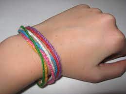 You'll have a bracelet, a belt, or even a scarf made in no time! Finger Knitting Bracelets How To Stitch A Knit Or Crochet Bracelet Yarn Craft On Cut Out Keep