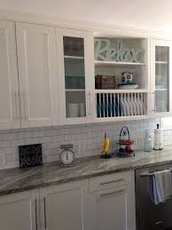 White Shaker Cabinets With Glass Doors Open Shelves Plate Rack Granite Counters Glass Cabinet Doors White Kitchen Countertops White Tile Kitchen Floor