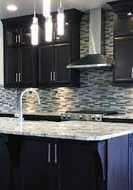 White and black shaker kitchen cabinets Gorgeous Customer Kitchen Featuring Dark Cabinets A Clean Modern Tile Backsplash And A Beautiful Stainless St Outdoor Kitchen Cabinets Kitchen Kitchen Design