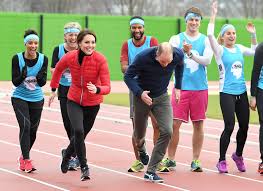 Athletes training relay race on empty stadium, teamwork, aspiration to win. William Kate And Harry Compete In Relay Race For Charity 3 Chinadaily Com Cn
