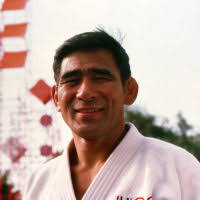Air Force Lieutenant Colonel Paul Maruyama, right, from Colorado Springs,  Colorado, coaches two members of the judo team for competition at the 1984  Summer Olympics