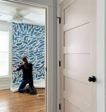 Once you are at the bottom ask another person to take the bottom and lay it flat on the backing. How To Hang Peel Stick Wallpaper On Video Young House Love
