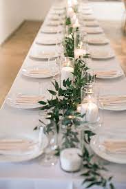 Minimal Garland With Candle Centerpiece Wedding All White Feasting Table Head Table Tablescap Simple Bryllupper Bryllupsborddaekning Bryllupsdekorationer