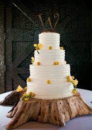 This Wedding Cake Was Iced In Vanilla Buttercream And Adorned With Billy Balls And Fresia Rustic Cake Stands Rustic Cake Wedding Cake Stands