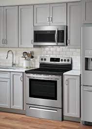 Stainless steel color refrigerator and stove isolated on white. Frigidaire 30 Electric Range Stainless Steel Ffef3054ts