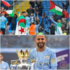 ووضع اللاعب العلم الجزائري على كتفيه، وحمل العلم الفلسطيني عاليا. Ø§Ù„Ø¬Ø²Ø§Ø¦Ø±ÙŠ Ù…Ø­Ø±Ø² ÙŠØ±ÙØ¹ Ø¹Ù„Ù…ÙŠ ÙÙ„Ø³Ø·ÙŠÙ† ÙˆØ§Ù„Ø¬Ø²Ø§Ø¦Ø± Ø¨Ø§Ø­ØªÙØ§Ù„Ø§Øª ØªØªÙˆÙŠØ¬ ÙØ±ÙŠÙ‚Ù‡ Ø¨Ø§Ù„Ø¯ÙˆØ±ÙŠ Ø§Ù„Ø§Ù†Ø¬Ù„ÙŠØ²ÙŠ