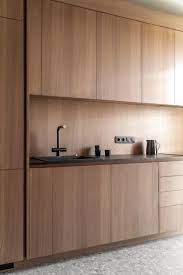 Complete the look with a cool grey backsplash and gorgeous waterproof plank. Wood Cabinets Without Hardware Are A Consistent Feature Throughout This Apartment