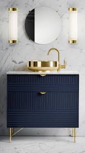 Pillar Wide Wall Light And Navy Blue And Gold Small Vanity With Marble Walls And Flooring Modern Bathro Decor Modern Bathroom Design Bathroom Interior Design