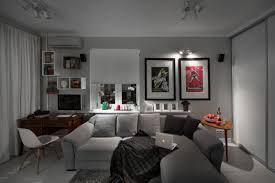 Vessels, sculptural paintings, photo frames, lamps)… Compact Bachelor Pad Captures All The Right Details In An Eclectic Design