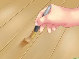 معالجة خدوش الأرضيات الخشبية Wikihow