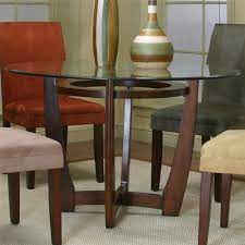 Most of these tables have a glass top whereas the base can be made of different materials, such as steel, iron, or wood. Cramco Inc Contemporary Design Parkwood 45537 47 41 Round Dining Table With Cherry Wood Base Corner Furniture Dining Tables