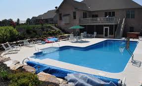 In Ground Pool Featuring A Vinyl Liner Hardscape Fencing And Retaining Wall Backyard Pool Landscaping Backyard Pool Swimming Pools
