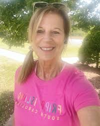 This is my husband Roger, he is American, but we live in Argentina (I'm  Argentine) it is summer here now! and he's very happy with his Isle of  Wight scooter rally T-shirt!!