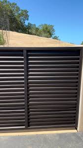 Custom slide gate for a residential trash enclosure. , Who knew galvanized  roofing made such a sleek fence panel. #weld