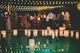 6 Charming Ways To Light Up Your Outdoor Wedding Pool Wedding Decorations Pool Wedding Wedding Backyard Reception
