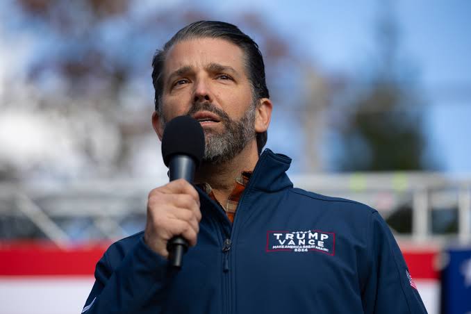 Donald Trump Jr. speaking at an event.
