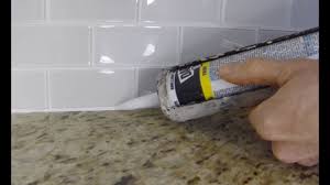 how to install caulk on a kitchen tile