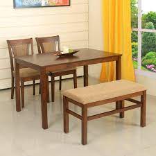 Raise your hand if your kitchen table — or dining room table — is made of wood? Home By Nilkamal Jewel 4 Seater Dining Table Set Walnut Buy Online In Burkina Faso At Burkinafaso Desertcart Com Productid 94393748