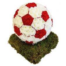 Red and white flowers such as roses, football mums, carnations and more are accented by baby's breath and salal. 3d Funeral Tribute Large Flower Arrangements Funeral Flowers Funeral Flower Arrangements