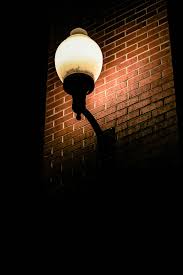 Kate dark brick wall photography backdrop with floor light brown. Hd Wallpaper Turned On Lights On Sconce Lighted Wall Lantern On Brick Wall Wallpaper Flare