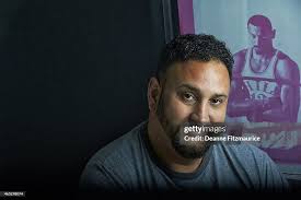 Closeup portrait of Aaron Levi with silk-screen of Philadelphia 76ers...  News Photo