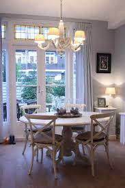 French Country Style Dining Room Baroque Style Chandelier White Round Top Dining Table Country Style Dining Room French Doors Interior Glass Round Dining Table