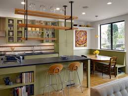 This chic and inviting kitchen by alys design combines a cozy dining space with custom cabinetry. 35 Inspiring Eclectic Kitchen Design Ideas