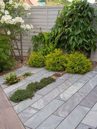 Paved In Ebony Cloud Schist Paving The Patio Stretches Across The Space And Is Interspersed With Japanese Garden Paving Zen Garden Design Modern Garden Design