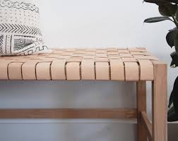 Two layers of leather straps are handwoven into a rich texture on the woven leather bench. Pin On Home Decor