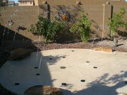 Splash Pad I Like The Idea Of The Splashpad As The Driveway To The Playhouse Garage Ck Backyard Splash Pad Backyard Splash Pad