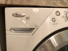 You can manually unlock the washer by removing the top (remove screws on the back of the top panel and slide the top panel back to lift off. How To Clean The Detergent Dispenser Drawer In A Front Load Washing Machine Dells Daily Dish