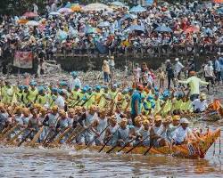Colorful longboats racing during the Bon Om Touk Water Festival in Cambodia