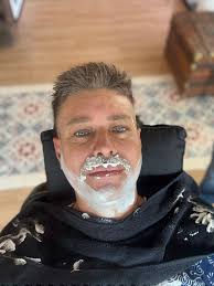 I haven't shaved off my beard for years... as it's pretty painful and I  don't like wind burn.. but I decided bugger it and got a barber to do it  with their