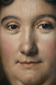 Pair of oval portraits of a man and a woman of quality