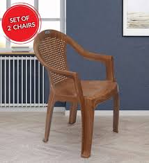 We love how this chair contains recycled content, so it looks good and does good too. Buy Plastic Chair Set Of 2 In Pear Wood Colour By Nilkamal Online Armed Plastic Chairs Chairs Furniture Pepperfry Product
