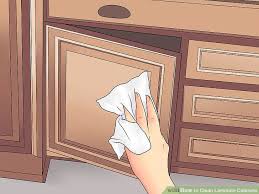 3 Ways To Clean Laminate Cabinets Wikihow In 2020 Laminate Cabinets Clean Laminate Laminate Kitchen Cabinets