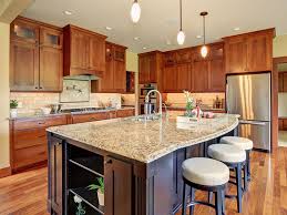 The key is to keep a balance of the light and the dark while also complimenting both. Contemporary Kitchen With Light Granite Counters Dark Wood Island Homedizz