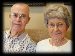 Above) “Coach” Leonard McCullough poses proudly with his son Carnival  Memphis King James McCullough, Jr. and Queen Suzette