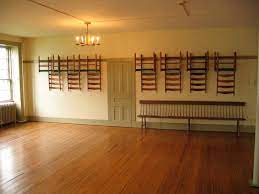 Simple lines create a dramatic look when used to create wall panels in a living room, dining room or family room. Steal From The Shakers Create A Smart Stylish Peg Rail Perimeter Apartment Therapy