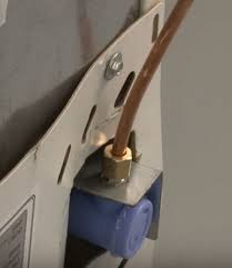 Slide on the pressure nut and then the ferrule from the water line kit. Bosch Refrigerator Easy Fix Denver Appliance Pros