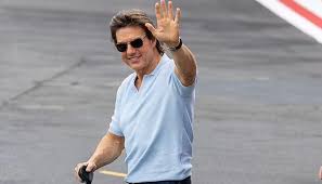 Tom Cruise looks dapper as he boards his helicopter after 'Mission: Impossible  7' promotions
