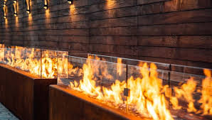 A horizontal board cedar fence provides privacy from the street and creates the cozy feeling of an outdoor room among the trees. Paloform Fire Pits Designed For Form Function And Safety London Uk Paloform