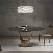 The very soft mint color on the walls made the red accents pop around the shop. Contemporary Dining Table Mobius Pacini Cappellini Tempered Glass Ash Base Walnut Base