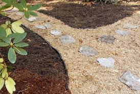 The diy mold is made of plastic and can be used multiple times when shaping mixed concrete. How To Create An Inexpensive Mulch And Stone Walkway
